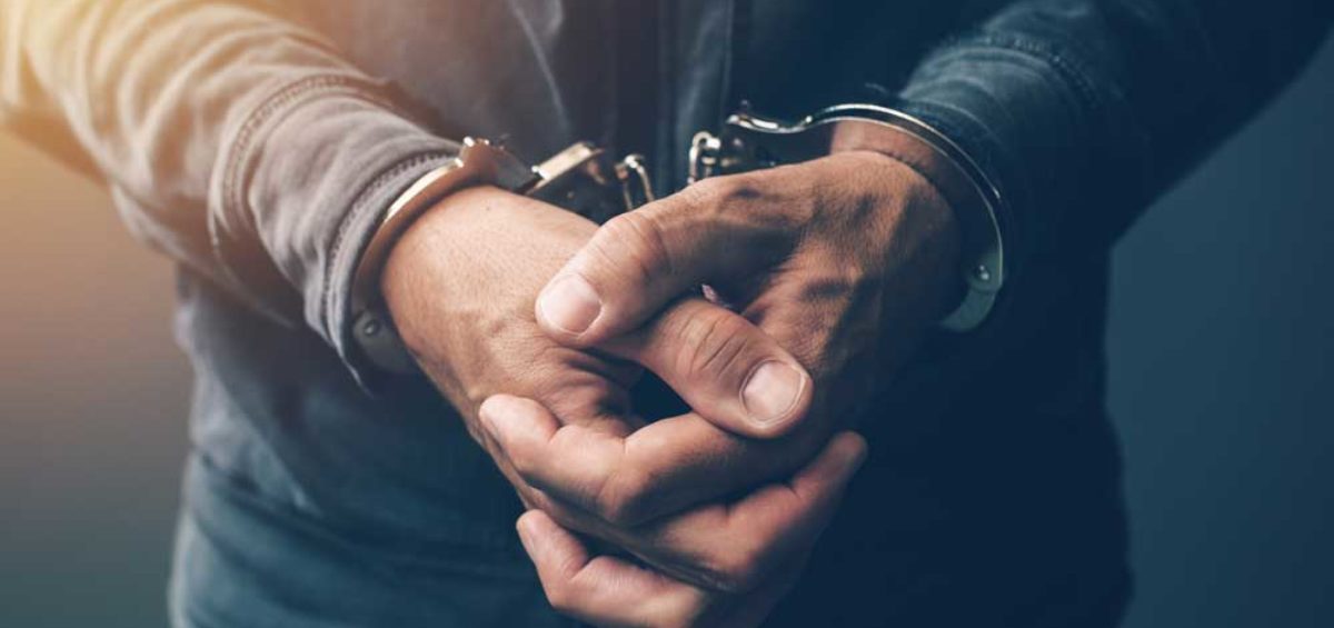 arrested, handcuffed man